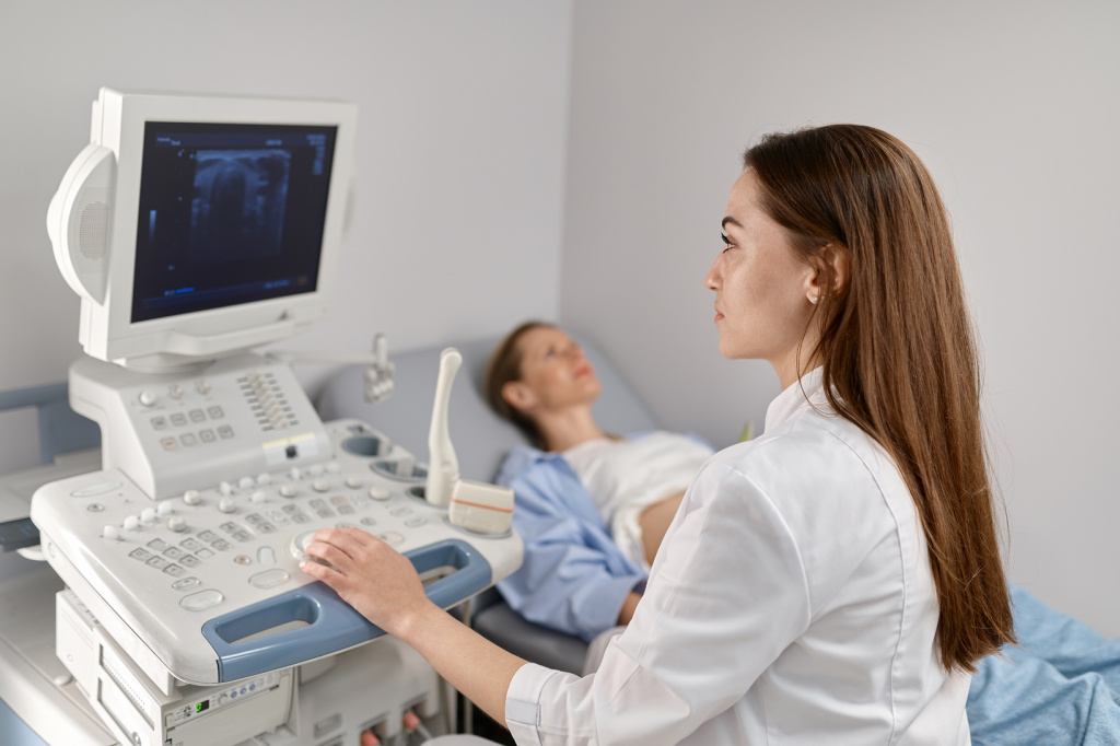 selective-focus-doctor-doing-ultrasound-fetus-pregnant-woman-modern-prenatal-clinic-office 1.jpg