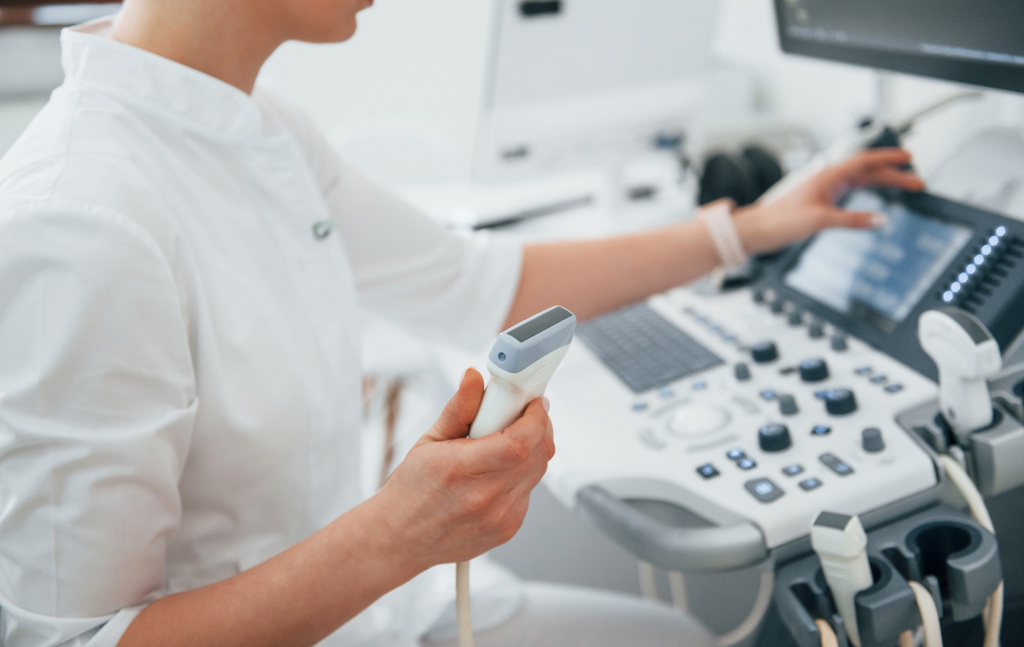 professional-female-clinic-worker-white-coat-is-indoors-cabinet 1.jpg